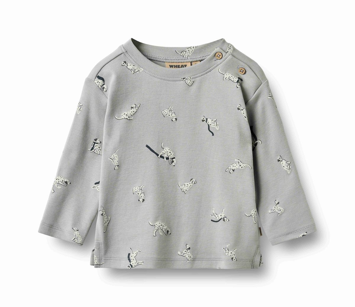 A light gray long-sleeve baby top with an all-over print of dalmatian dogs and a small black leash displayed on a clean white background.