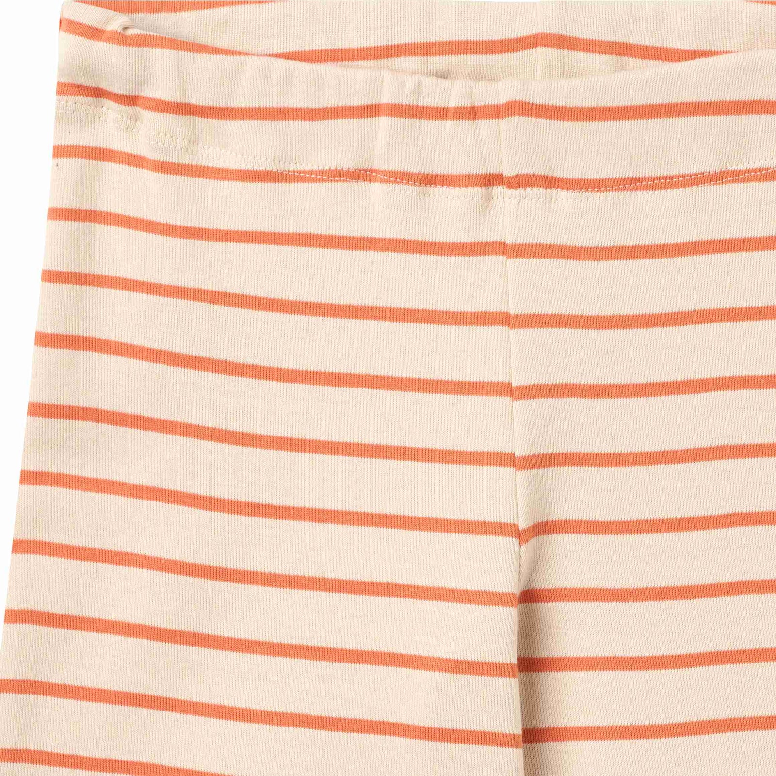 Striped pants with orange and white stripes on a white background