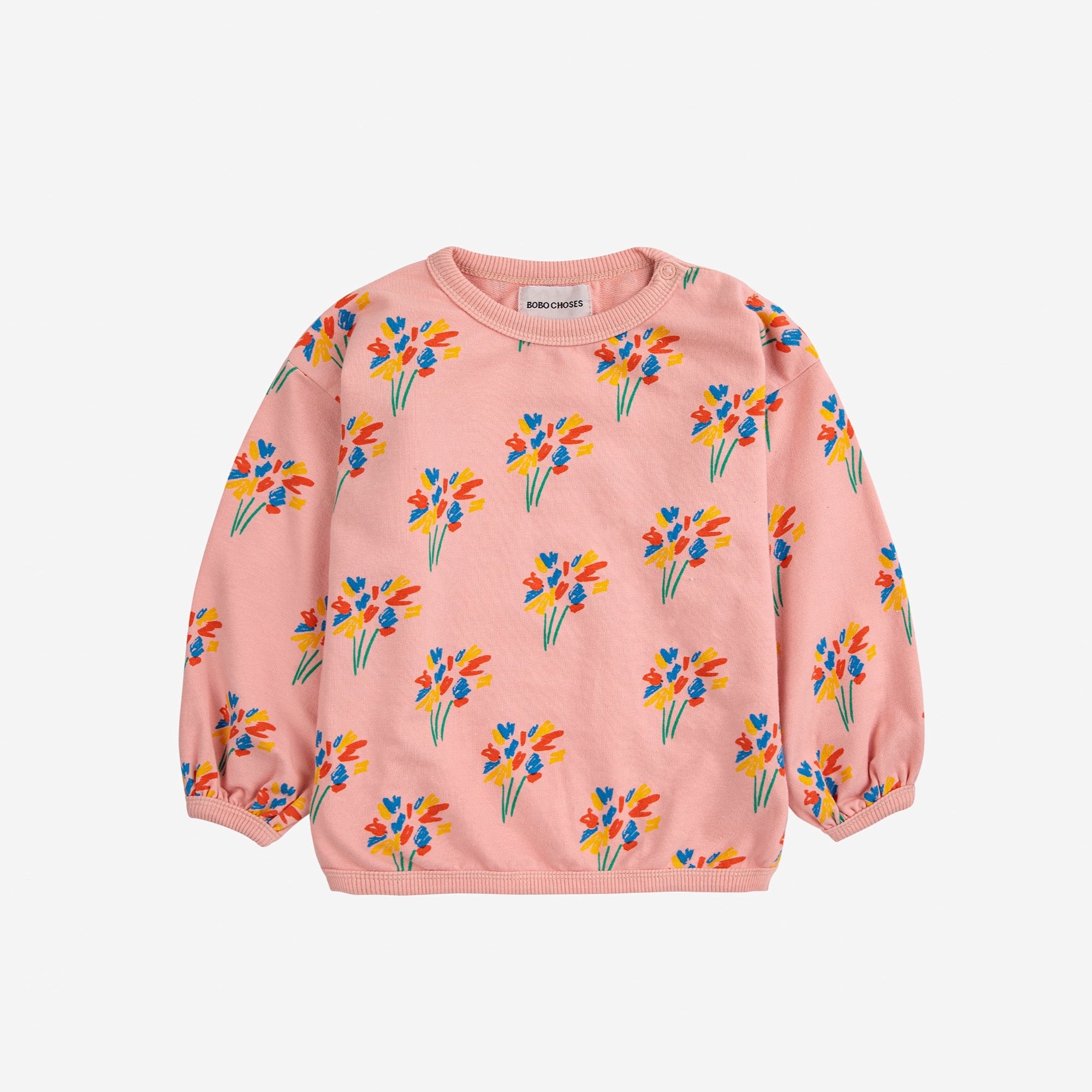 child wearing pink sweatshirt with colorful firework print