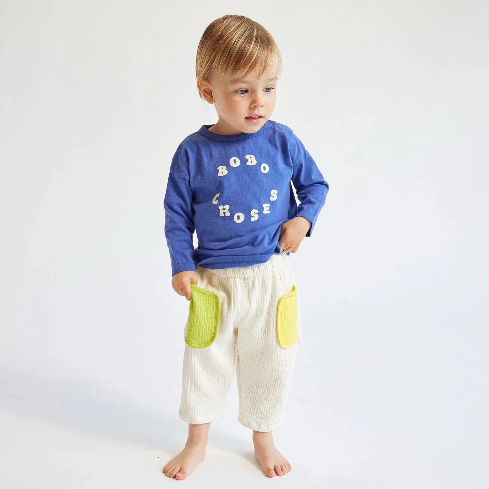 child wearing pants with blue sweatshirt