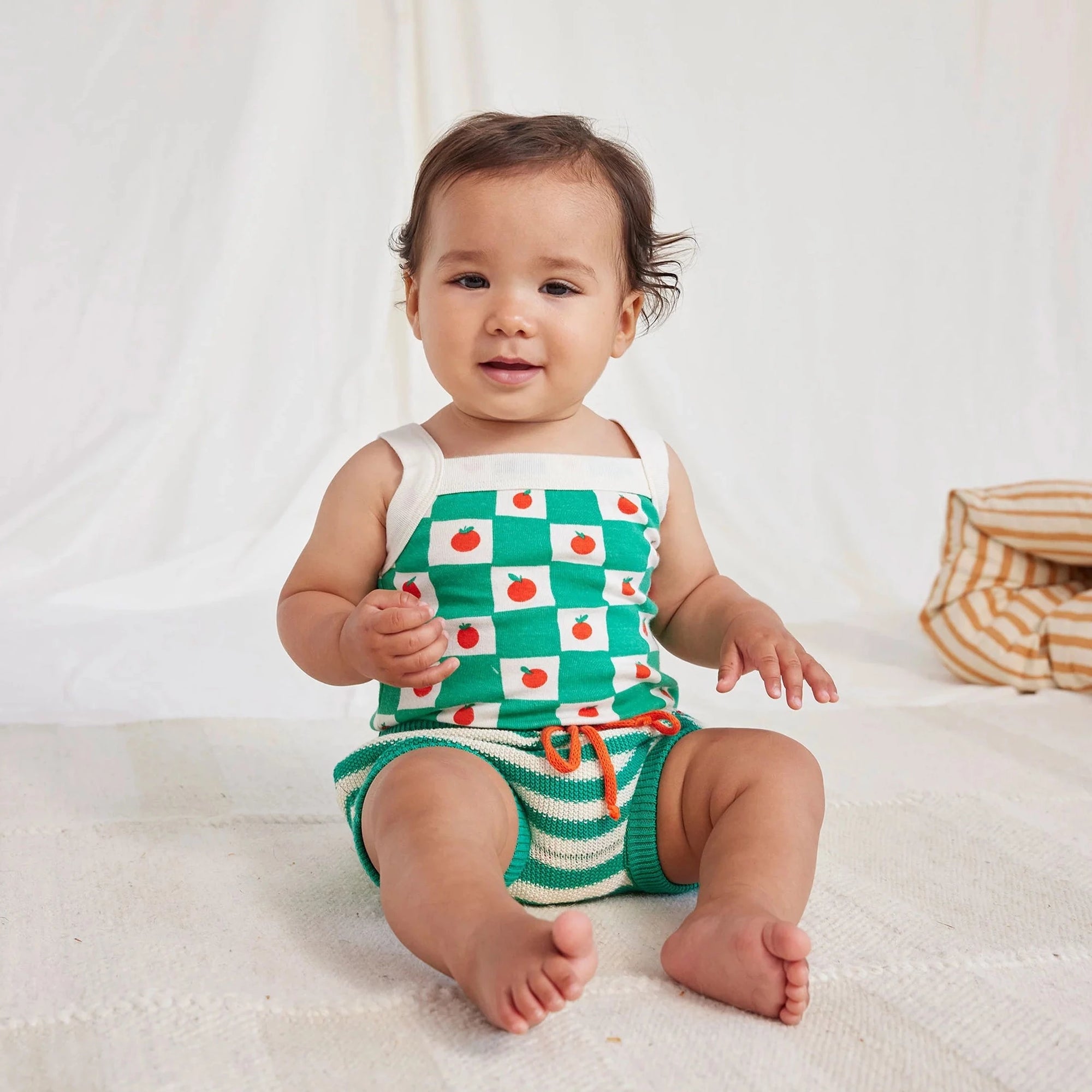 green and white knit baby bloomers