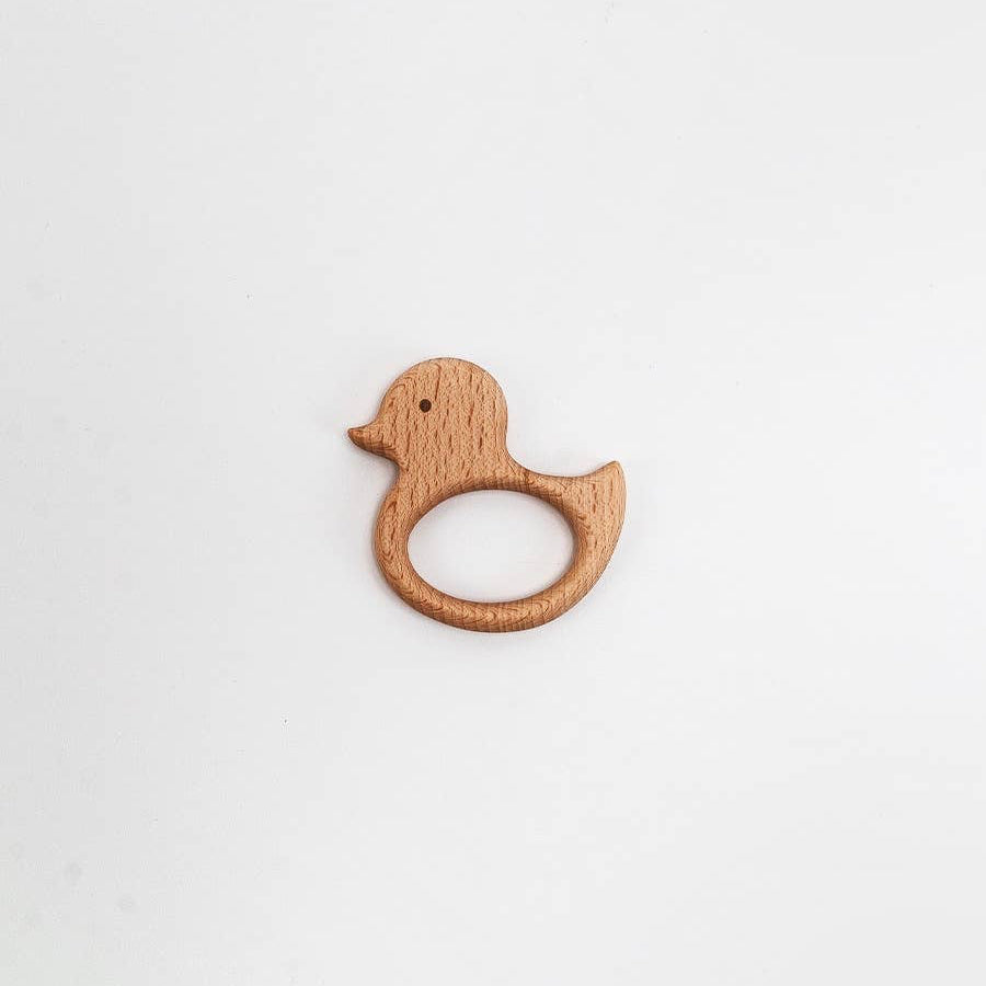 Wooden duck-shaped teething ring on a white background