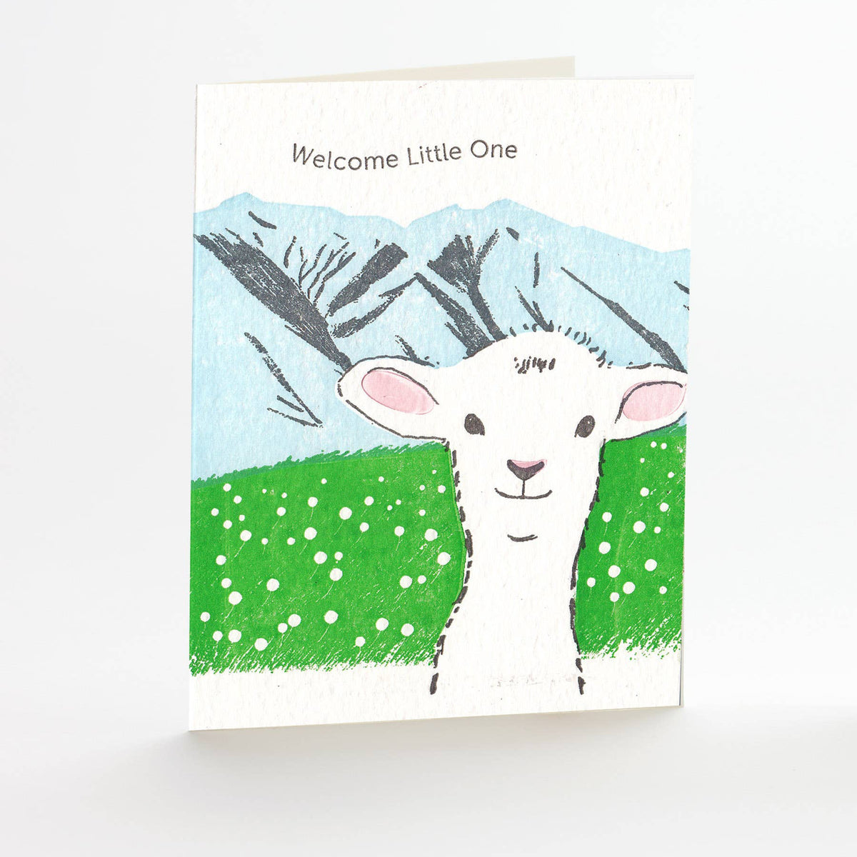 Greeting card with a drawing of a lamb and text 'Welcome Little One' on a white background