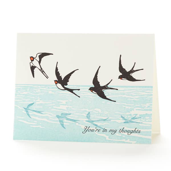 Card with illustrations of birds flying over water and text 'You're in my thoughts' on a white background.