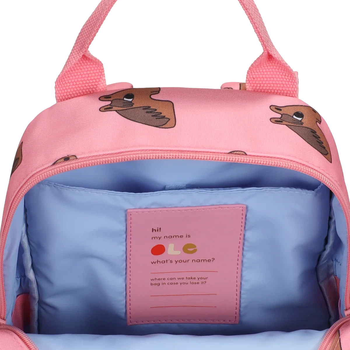 A pink backpack with a horse animal print, shown open to reveal a light blue interior. A pink label inside reads 'hi! my name is what's your name?'.