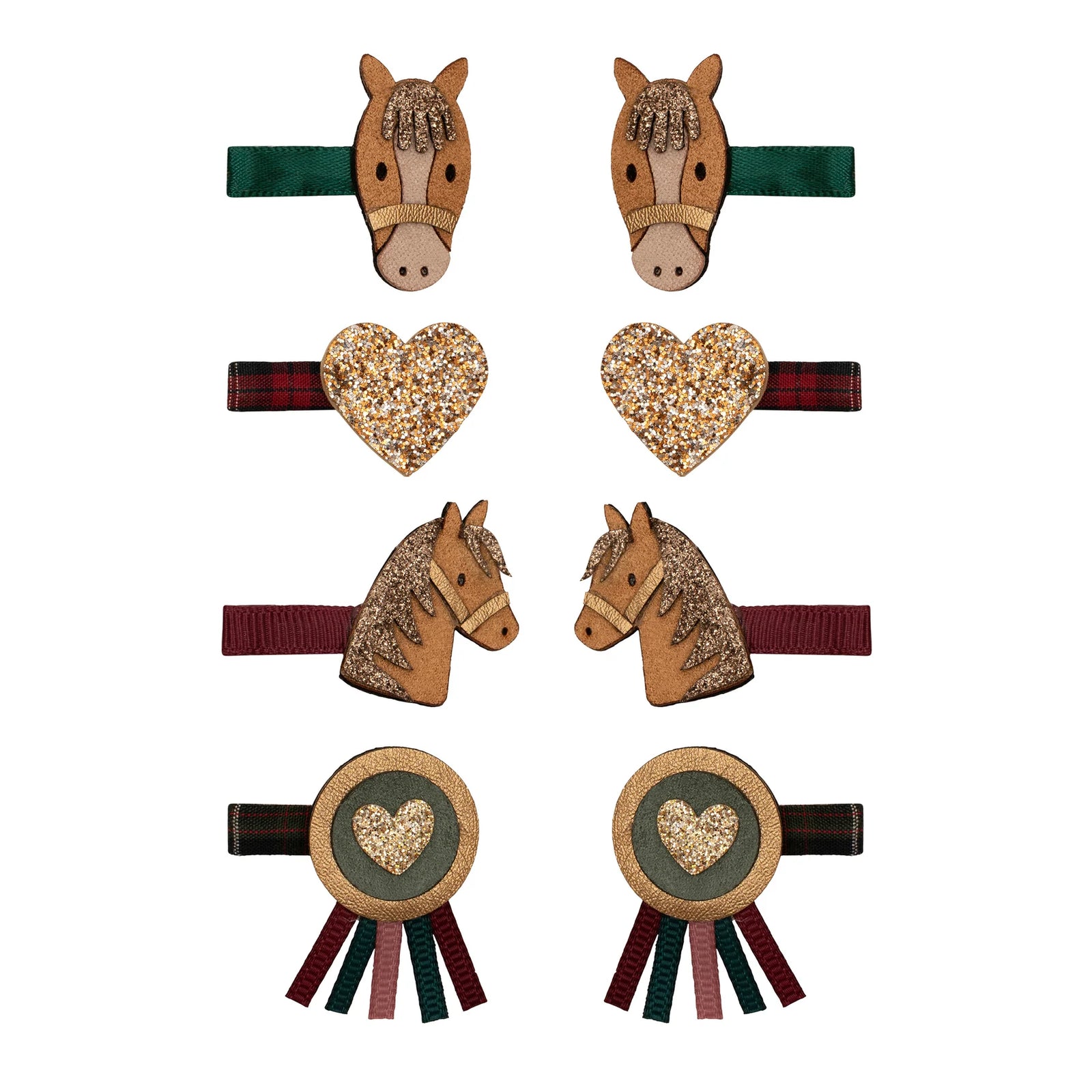 Child with decorated hair clips on a plain background