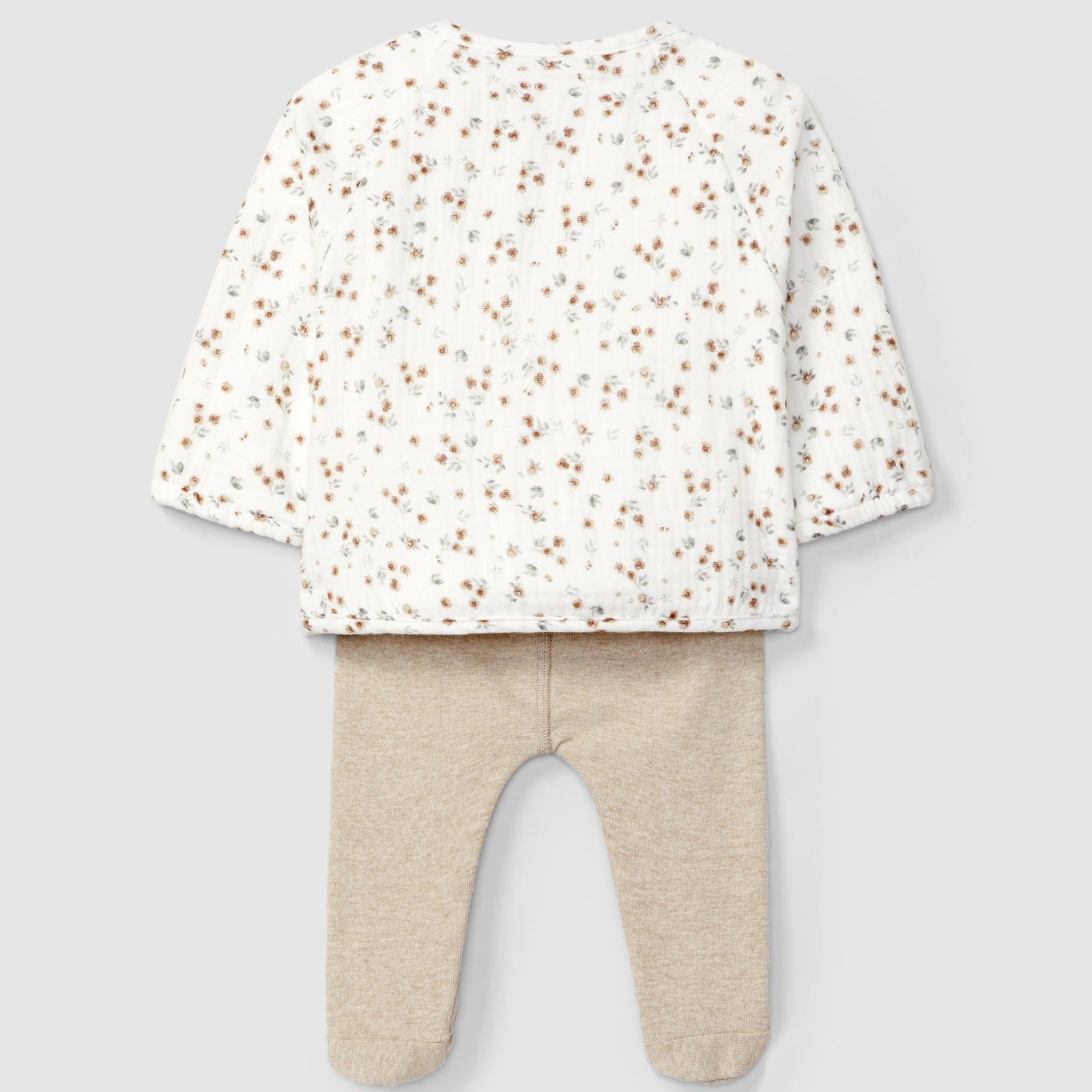 Baby outfit with floral top and beige pants on a light gray background