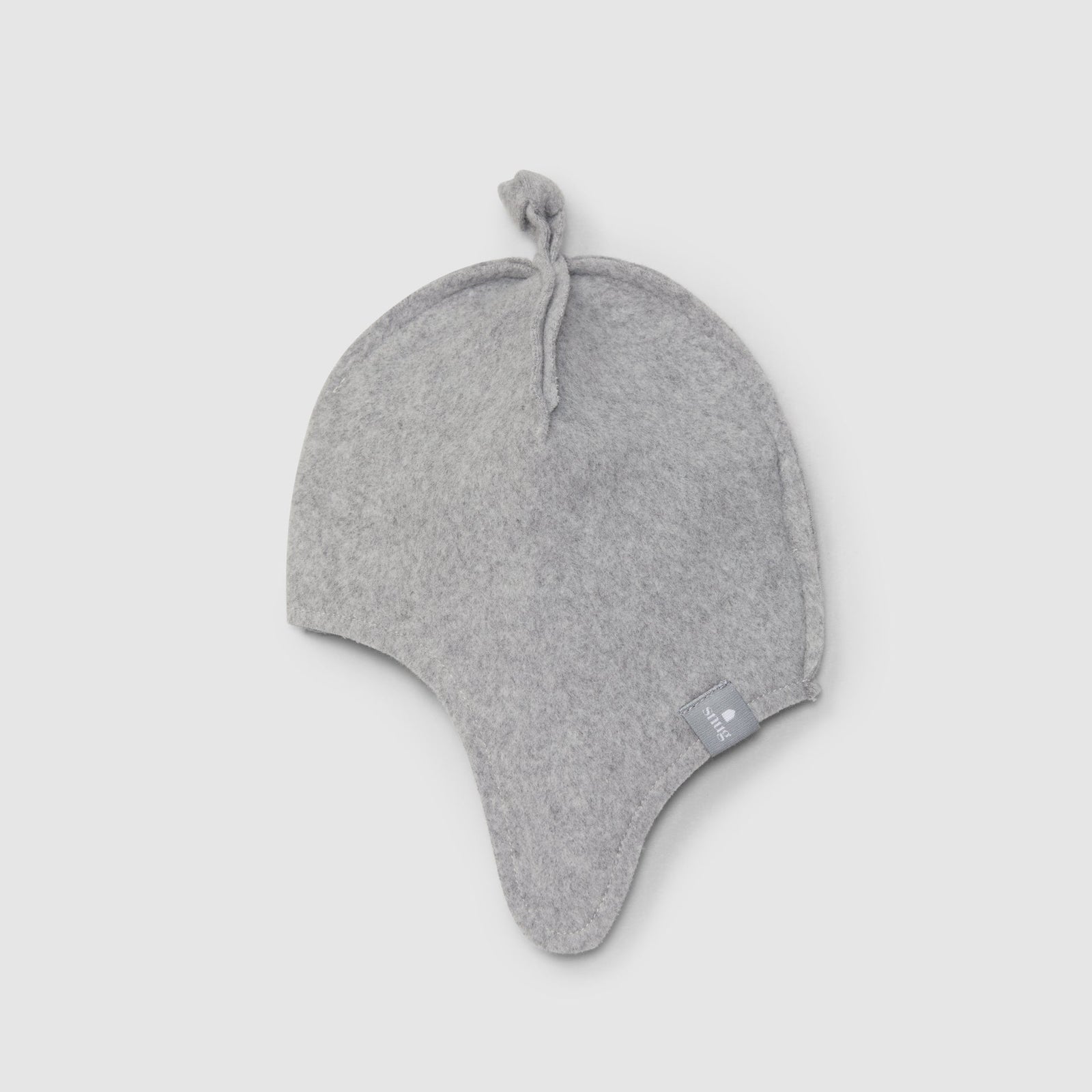 Gray baby hat with ear flaps on a light gray background