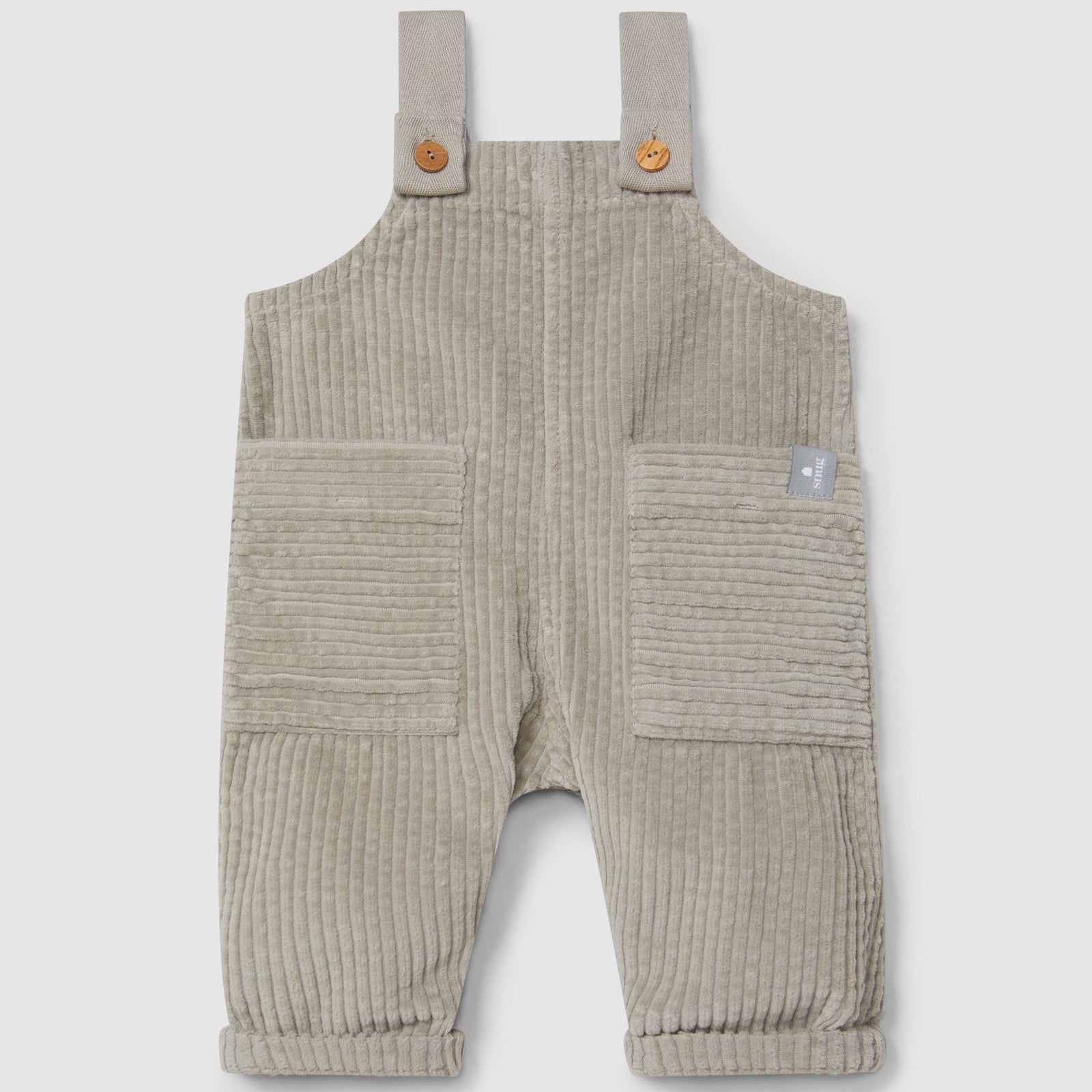 Beige corduroy overalls on a light gray background