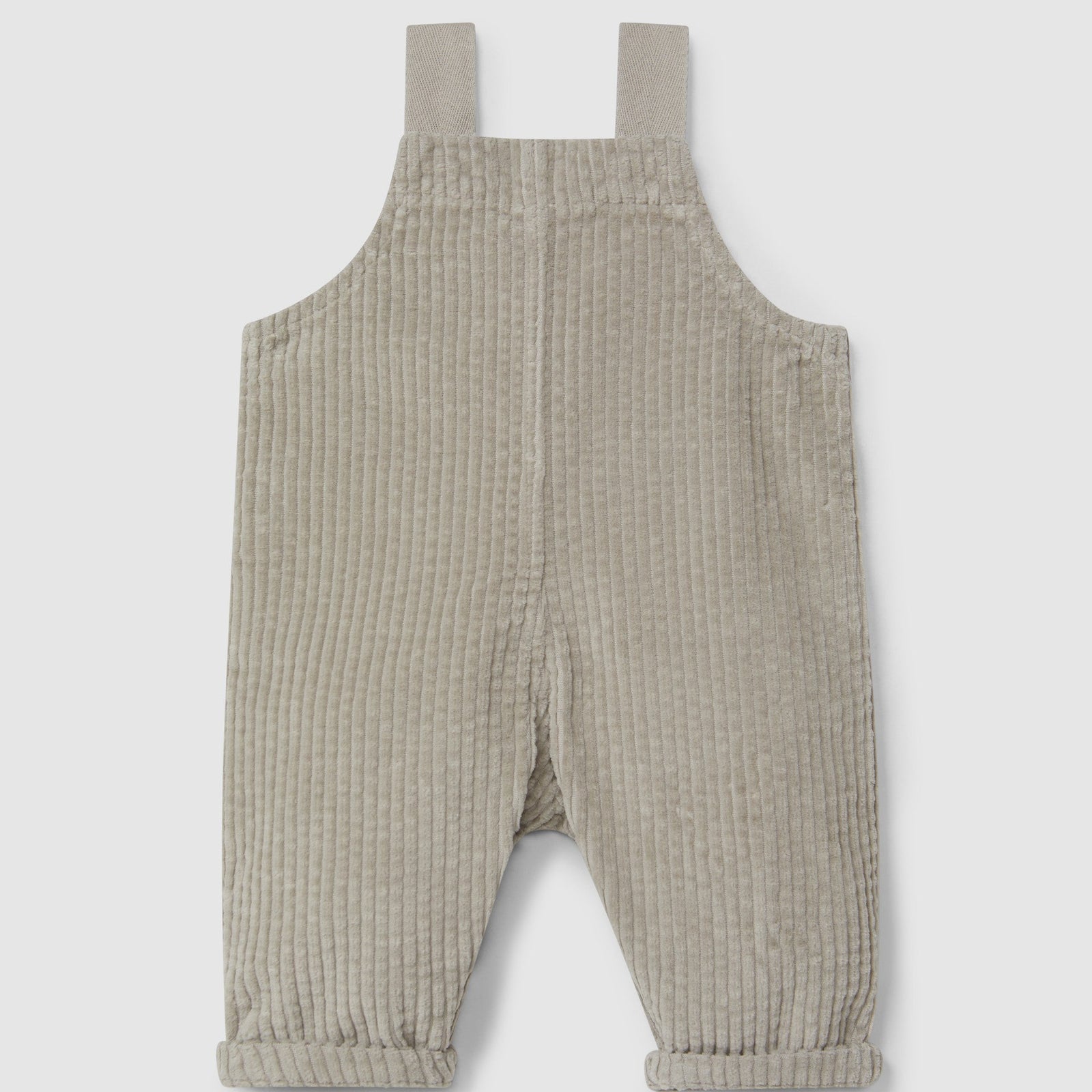 Beige corduroy overalls on a light gray background
