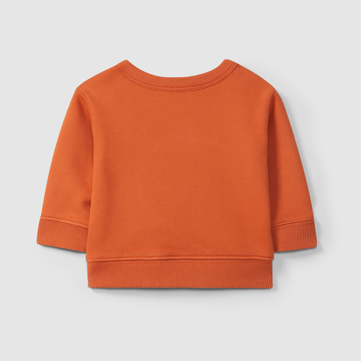 Orange sweatshirt on a light gray background