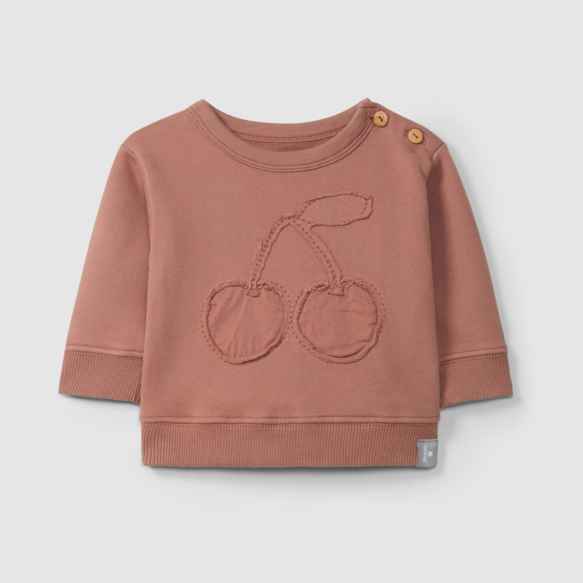 mauve baby sweatshirt with cherry design on a light gray background