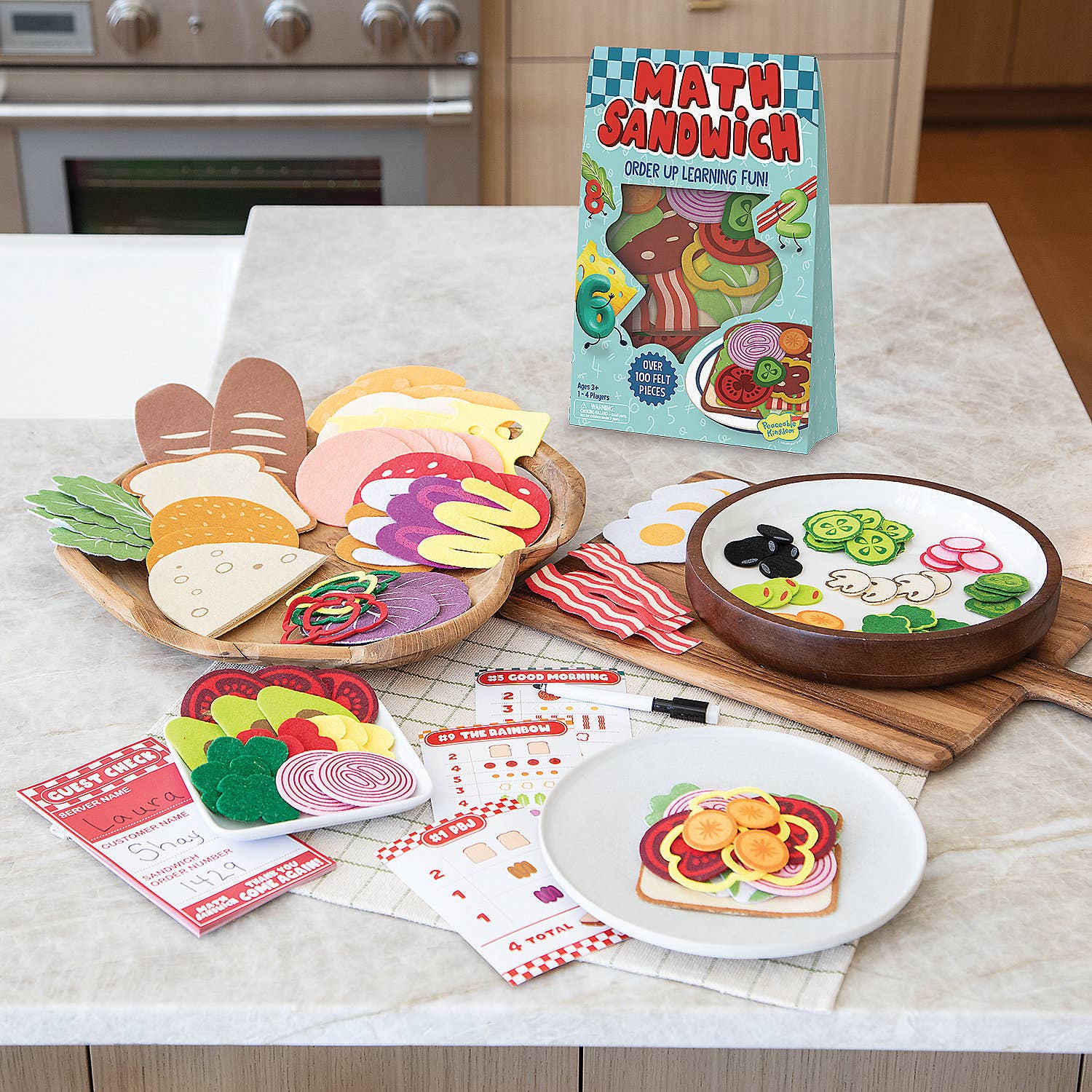 Math Sandwich educational toy set on a kitchen counter with a book titled 'Math Sandwich'.