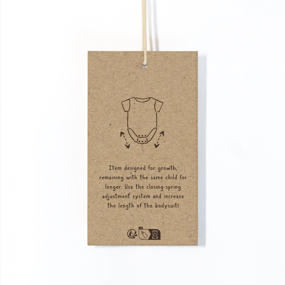 Kraft paper tag with a baby onesie illustration and text on a white background