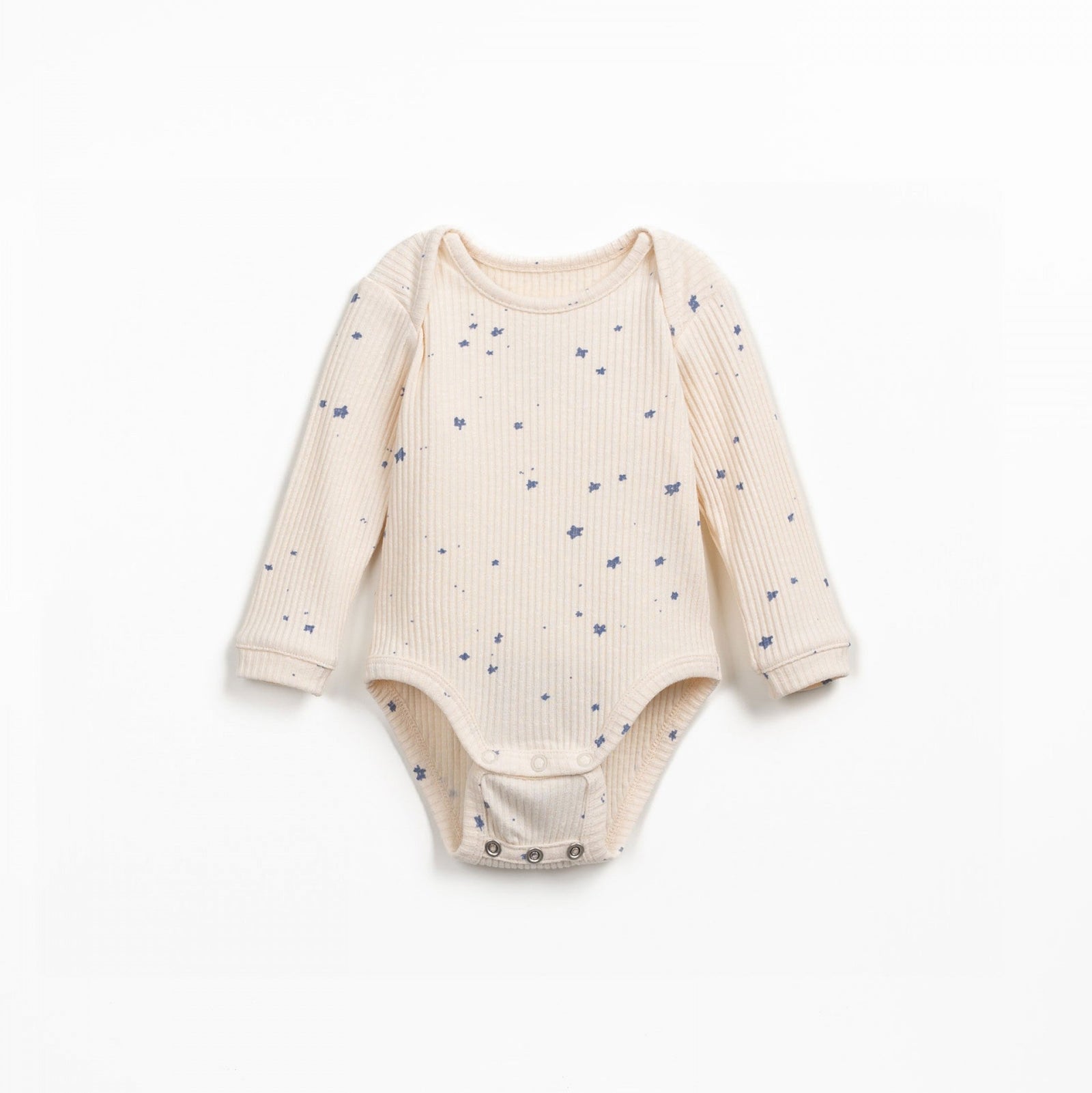 Baby outfit with onesie, hat, and pant on a light background