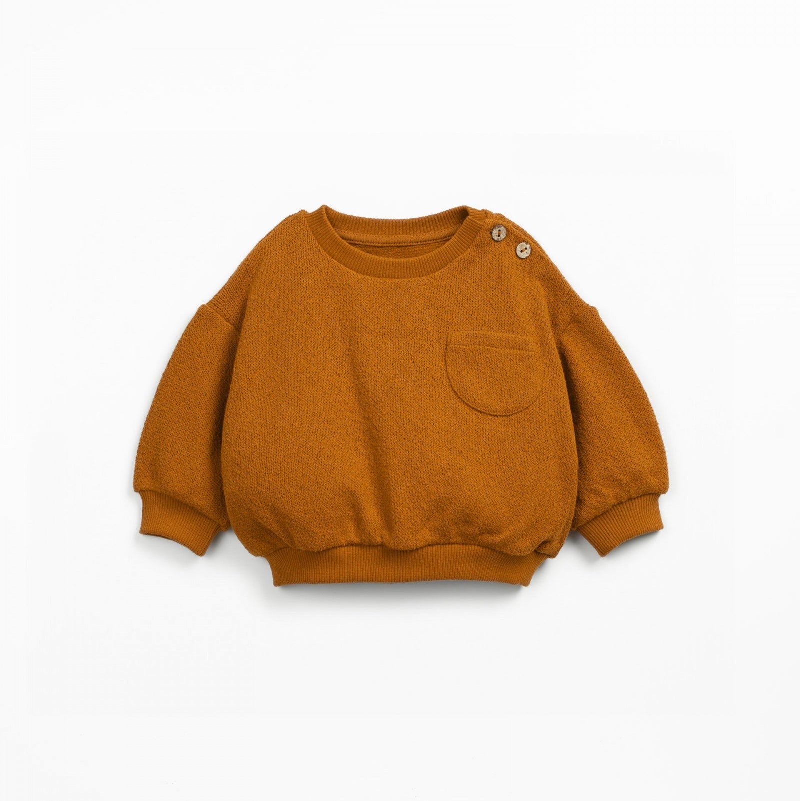 Orange sweater with a pocket on a white background