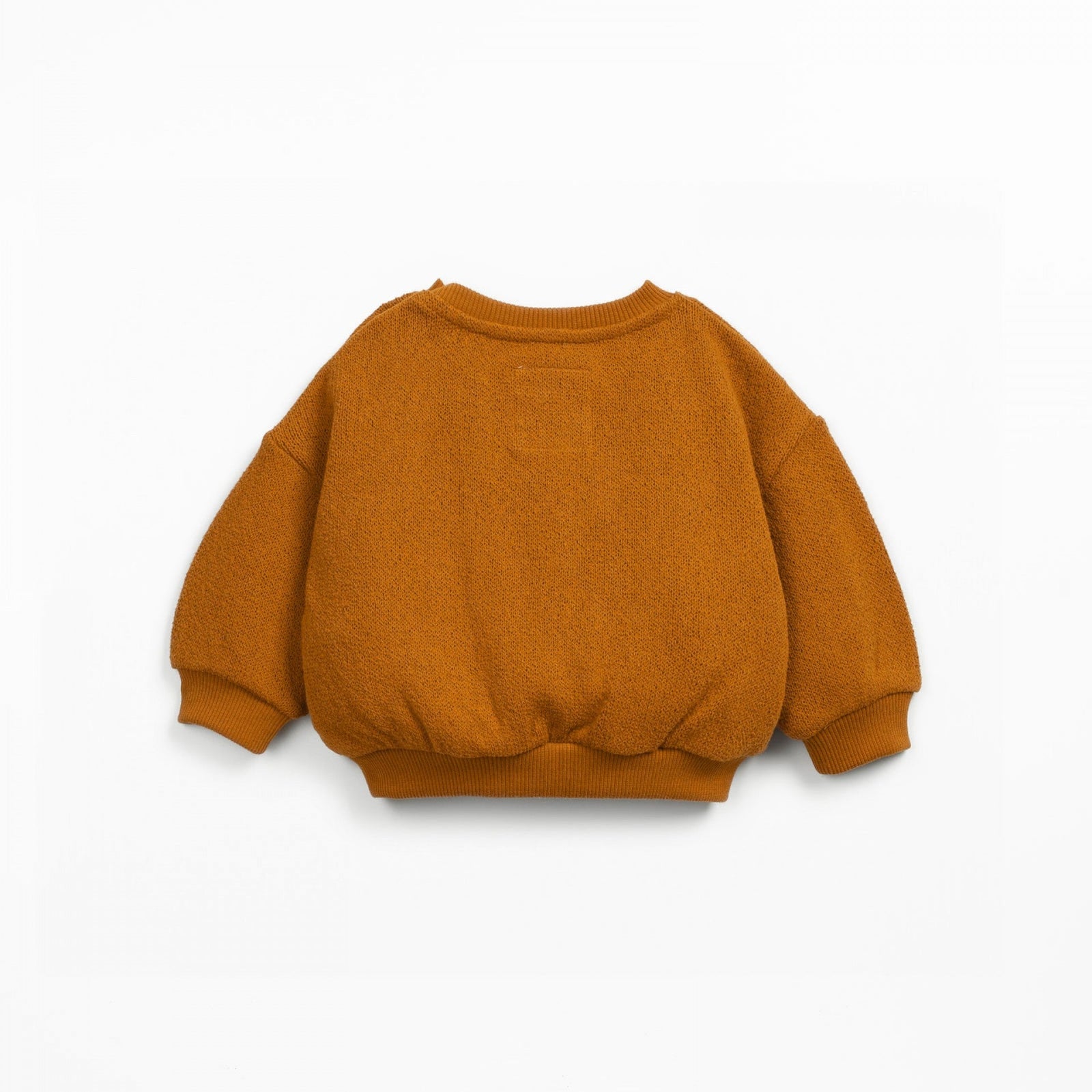 Orange sweater with a pocket on a white background