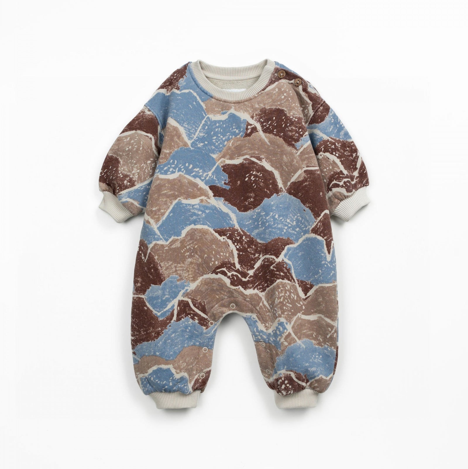 Camouflage-patterned baby onesie on a white background