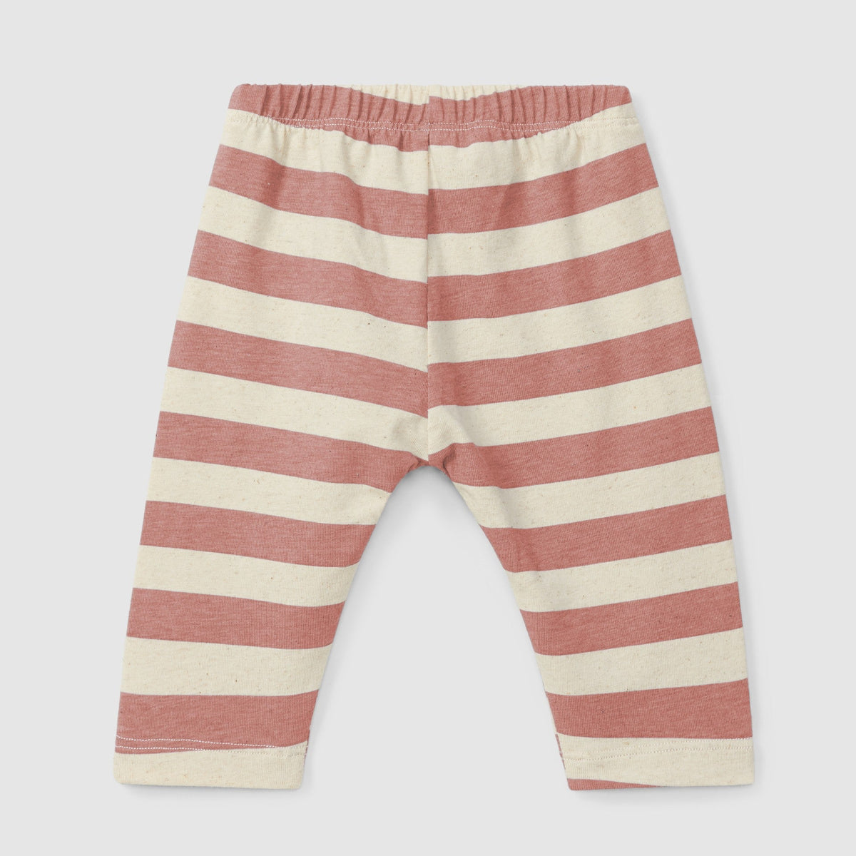 Striped baby pants with pink and beige stripes on a light gray background