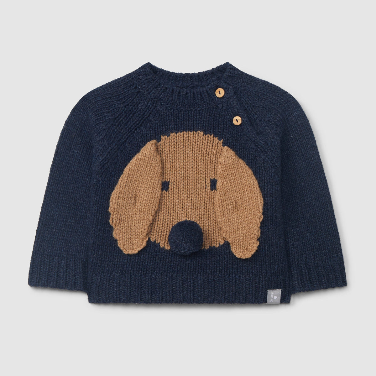 A navy blue knit baby sweater featuring a large brown dog face motif on the front, with two small wooden buttons near the collar, shown against a light gray background.