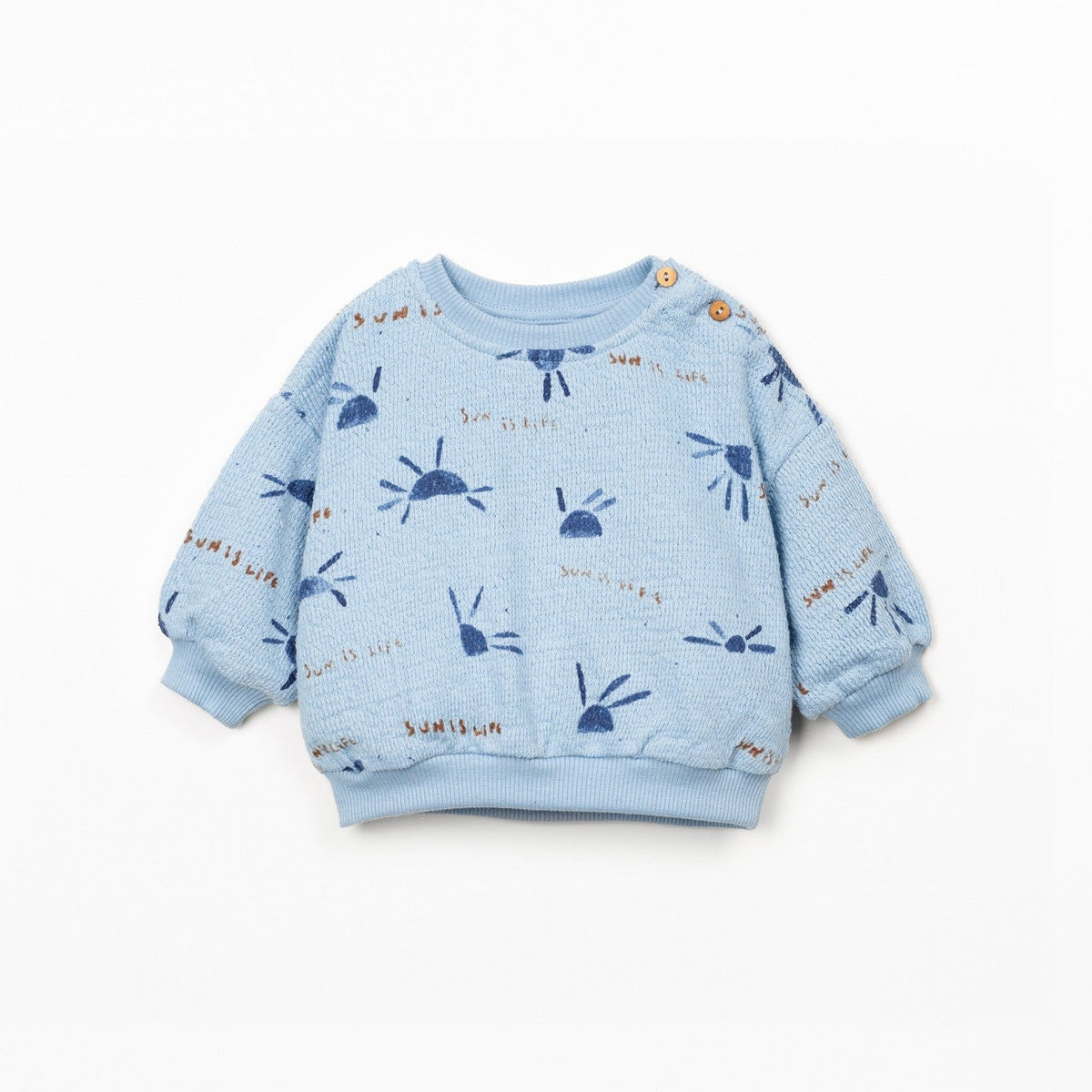 Blue children's sweatshirt with patterns on a white background