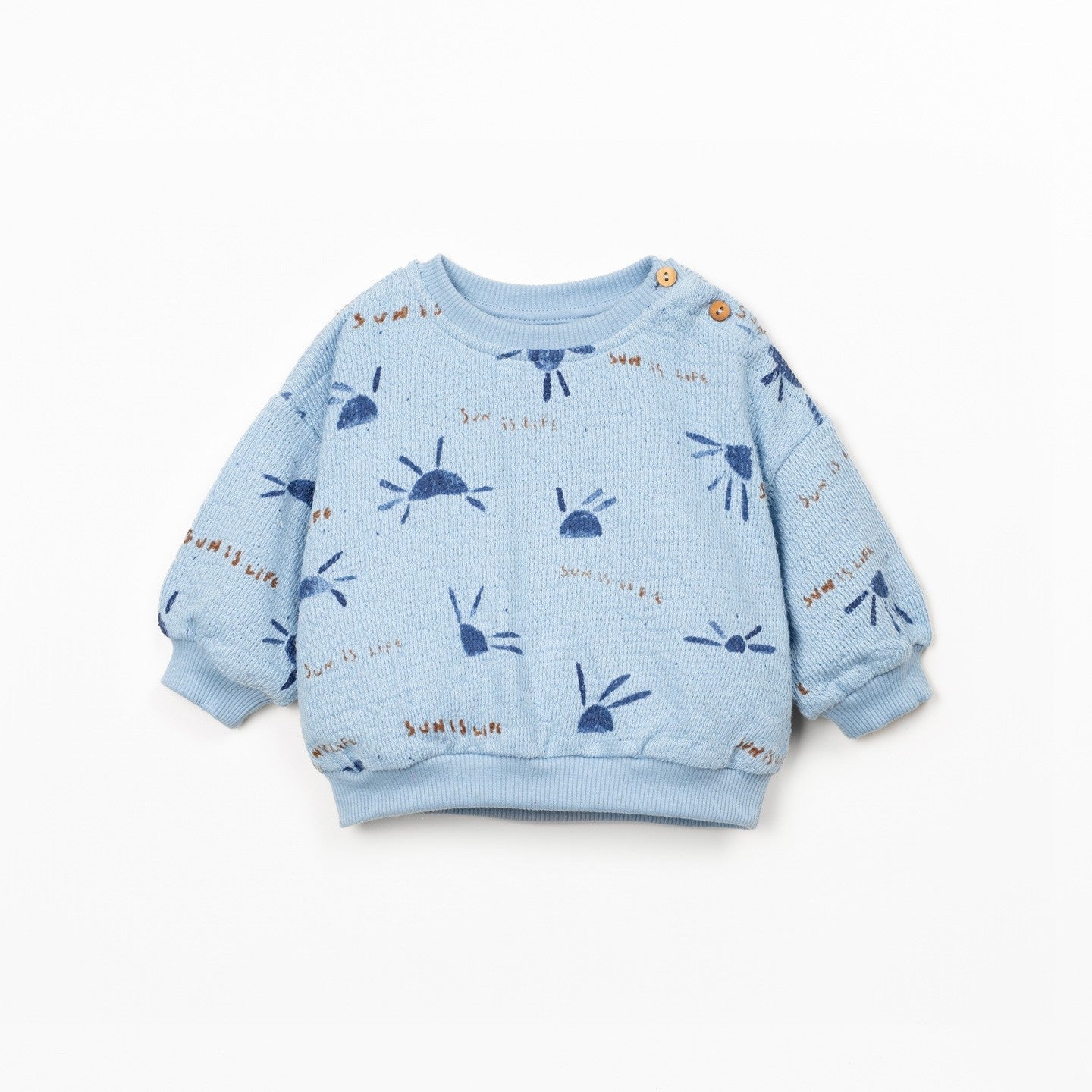 Blue children's sweatshirt with patterns on a white background