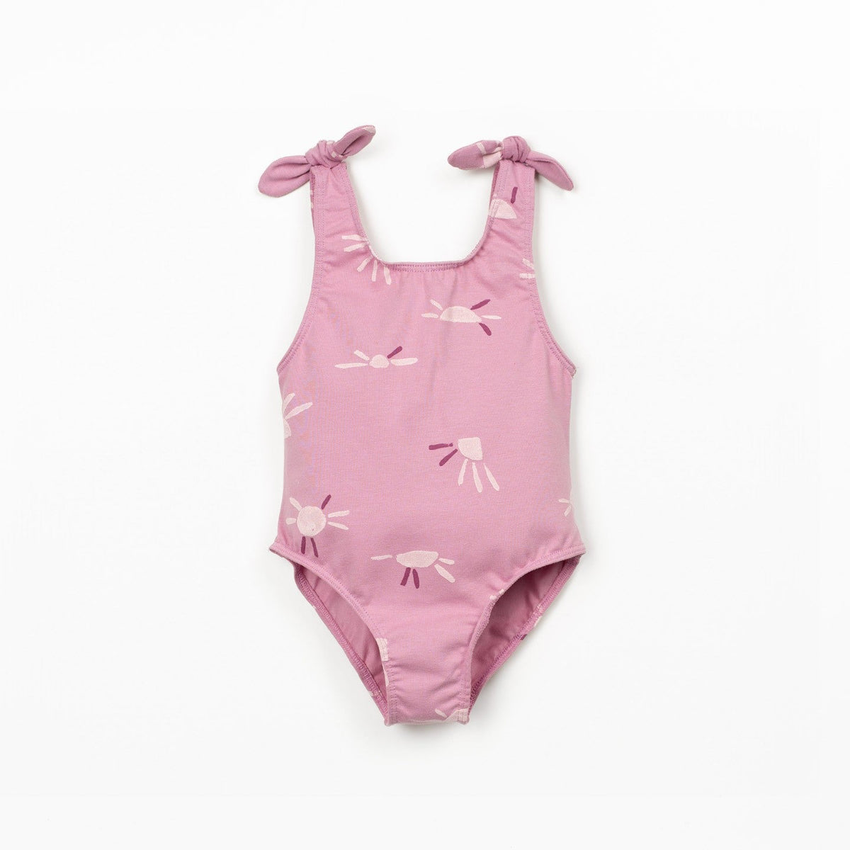 Pink swimsuit with sun pattern on a white background