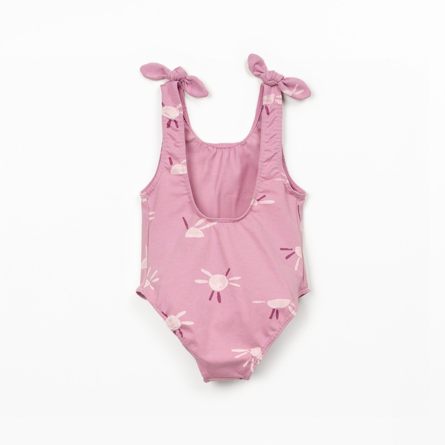 Pink swimsuit with sun pattern on a white background