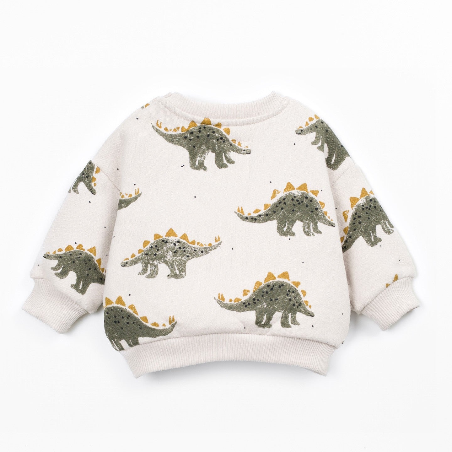 A long-sleeve knit sweater in cream with an all-over print of green and yellow dinosaurs, shown flat on a white background.
