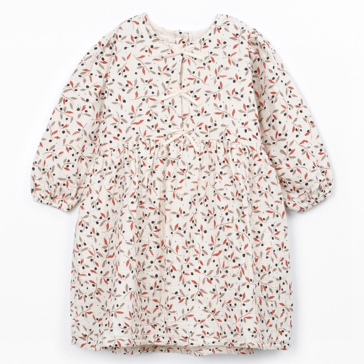 A long-sleeve dress with a dense, all-over micro-print pattern of small orange, black, and red shapes on a warm off-white background. The dress features a round neckline, a gathered waist, and a flared skirt, shown flat against a clean white background.