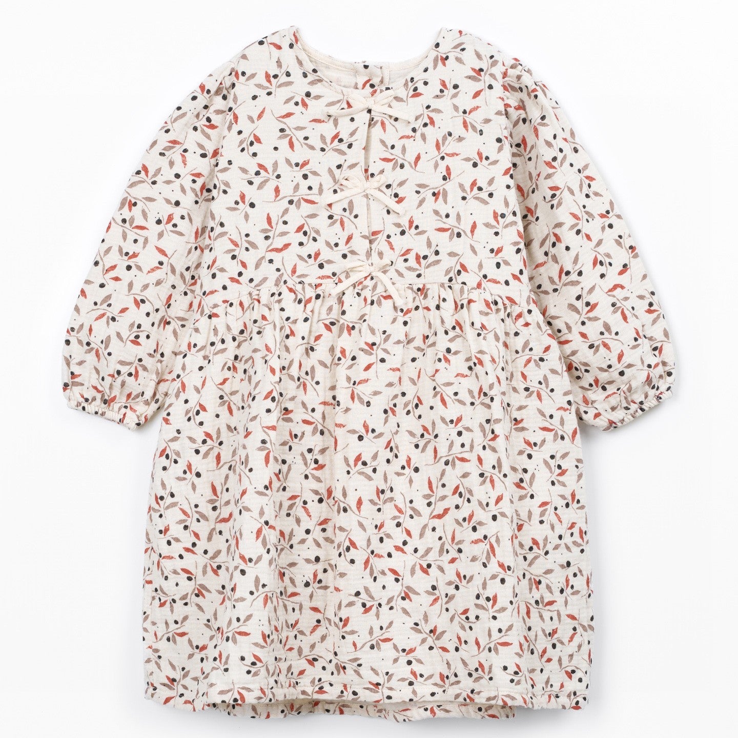 A long-sleeve dress with a dense, all-over micro-print pattern of small orange, black, and red shapes on a warm off-white background. The dress features a round neckline, a gathered waist, and a flared skirt, shown flat against a clean white background.