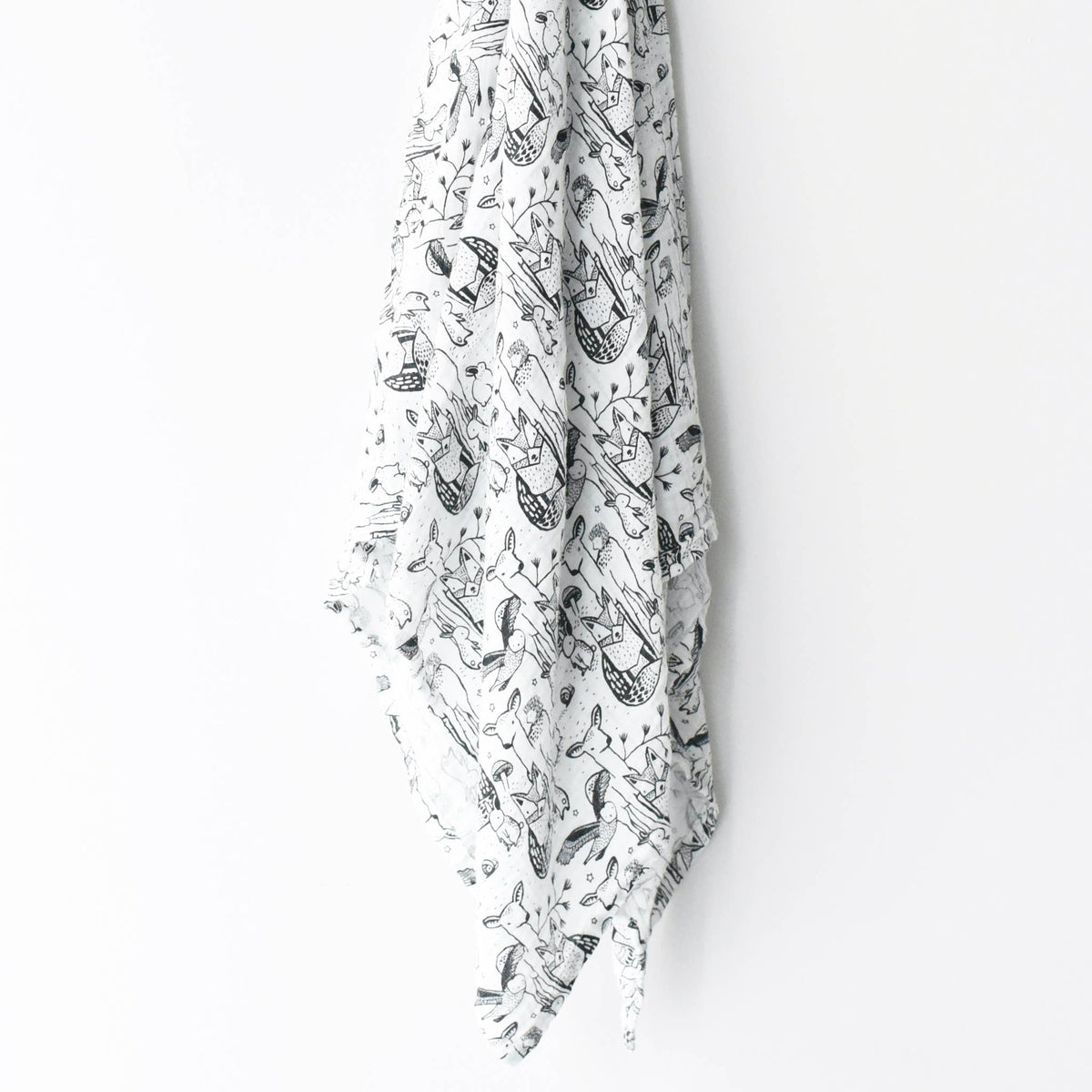 Length of swaddle hanging on white background