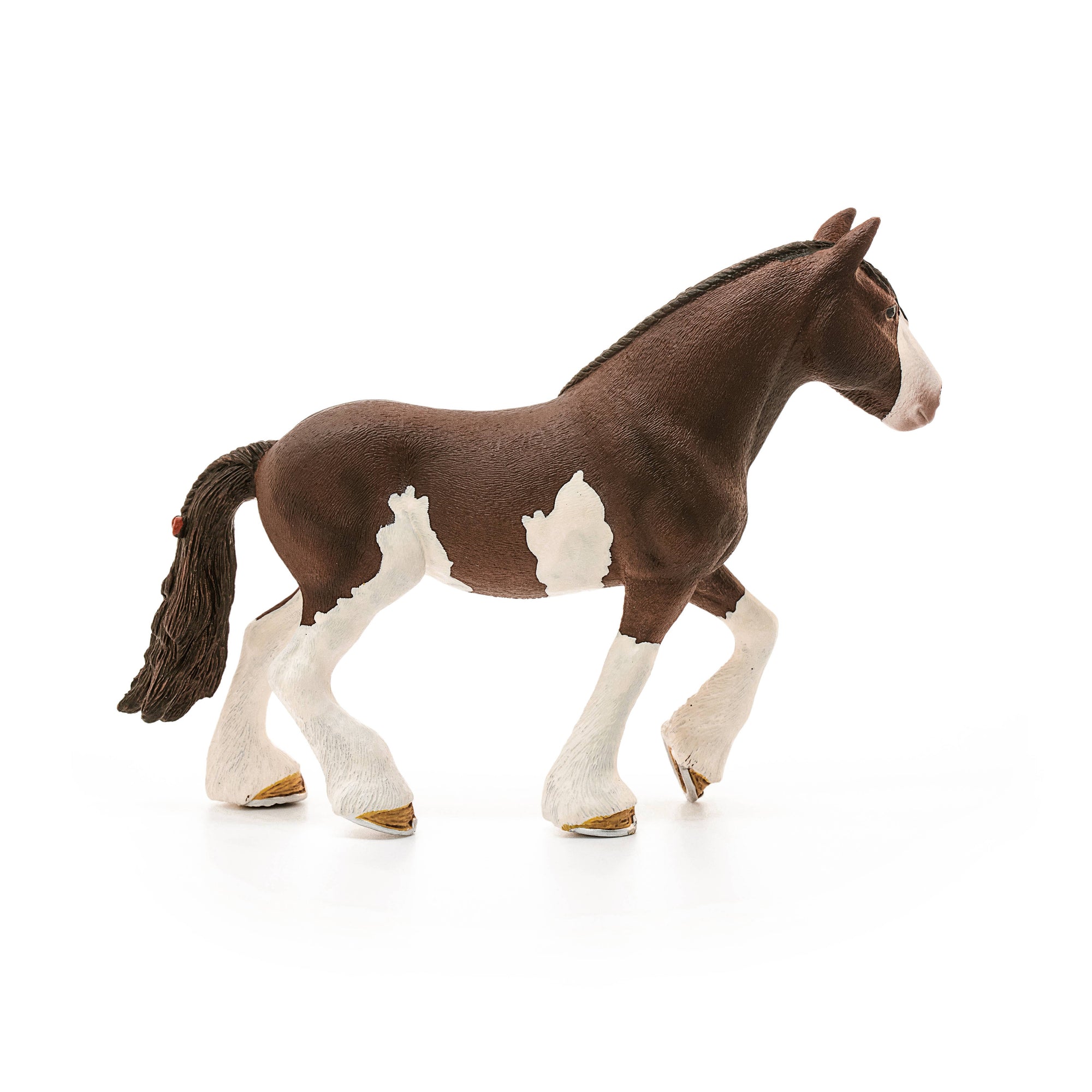 Model horse with a braided mane on a white background
