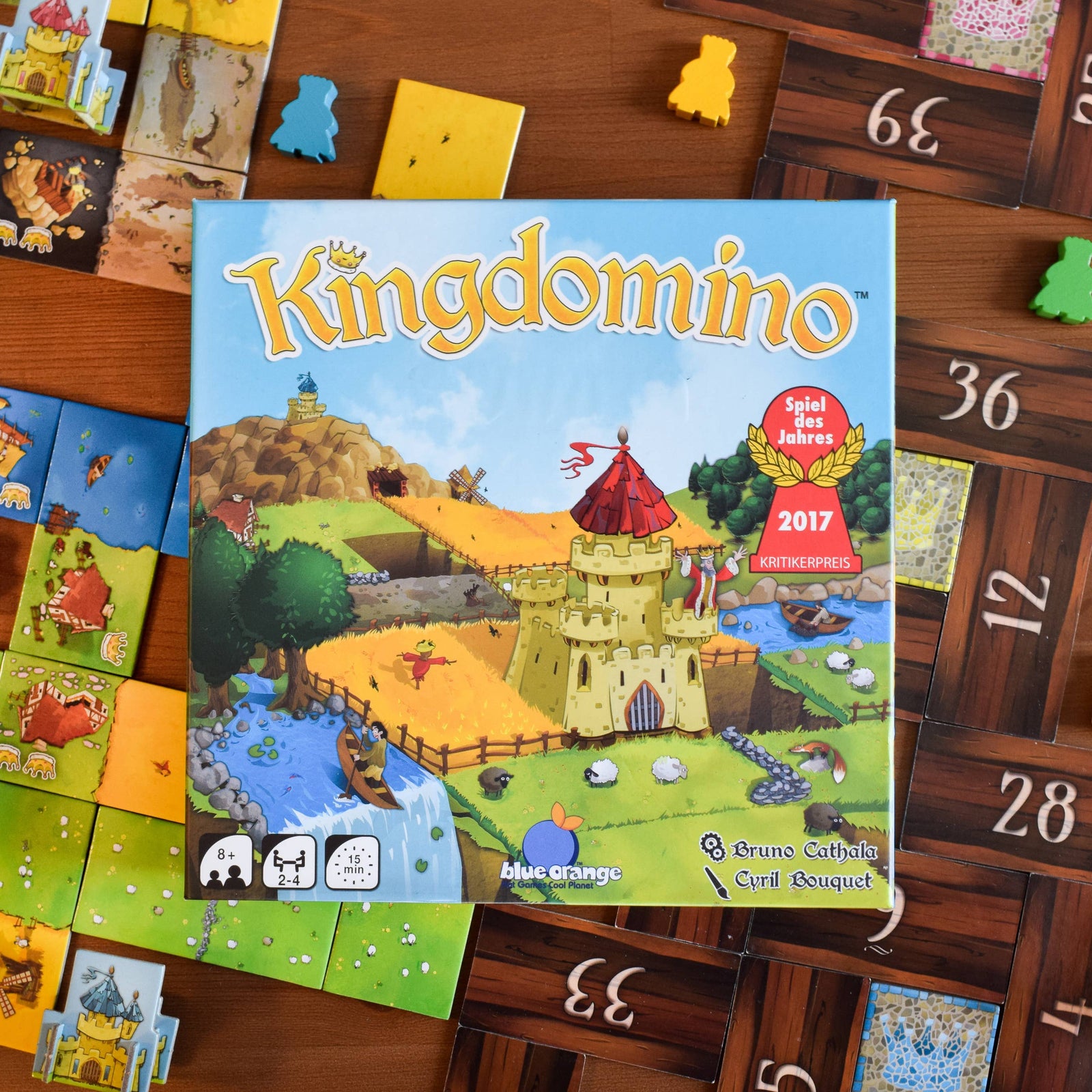 Board game box for 'Kingdomino' with colorful illustration and game details.