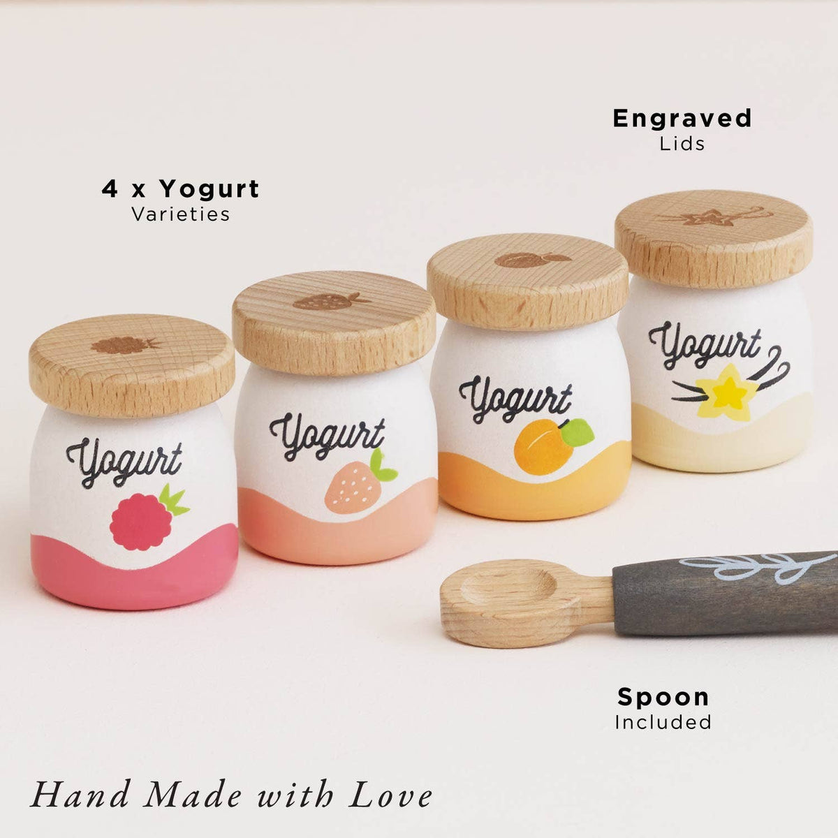 Set of four yogurt jars with wooden lids on a white background