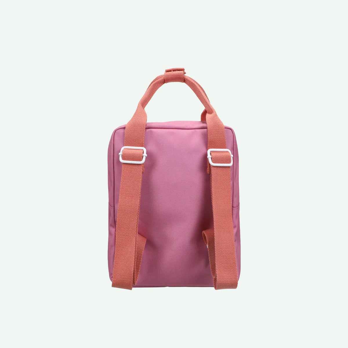 Pink backpack with orange straps on a light pink background