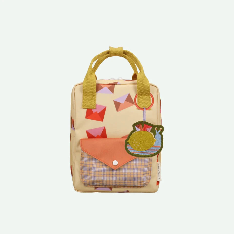 Small backpack with colorful design on a white background