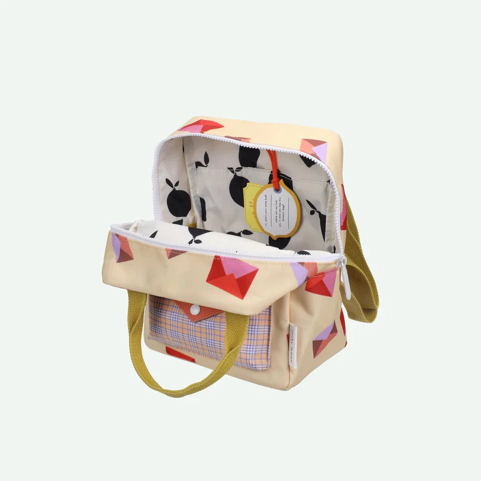 Colorful patterned bag with a yellow strap on a white background
