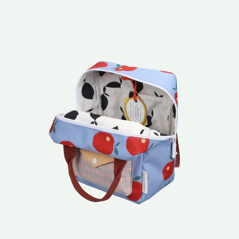 Children's backpack with cherry pattern on a light gray background