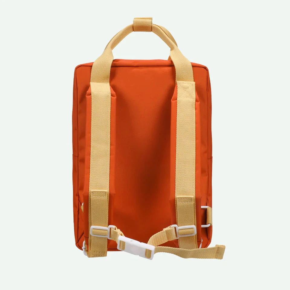 Orange backpack with beige straps on a white background
