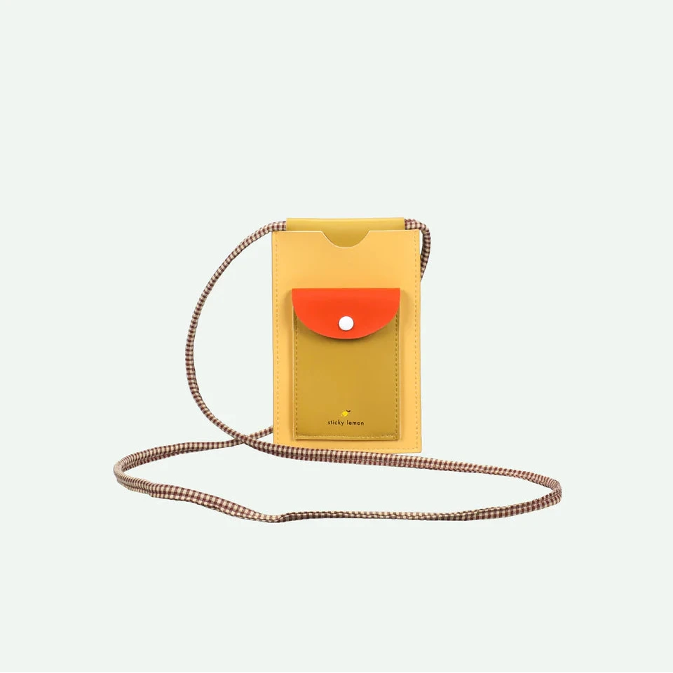 Yellow phone pouch with a orange accent on a white background