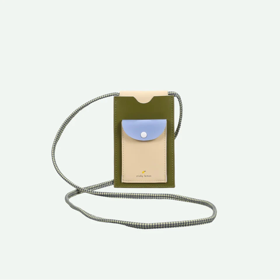 Phone case with a strap on a light gray background