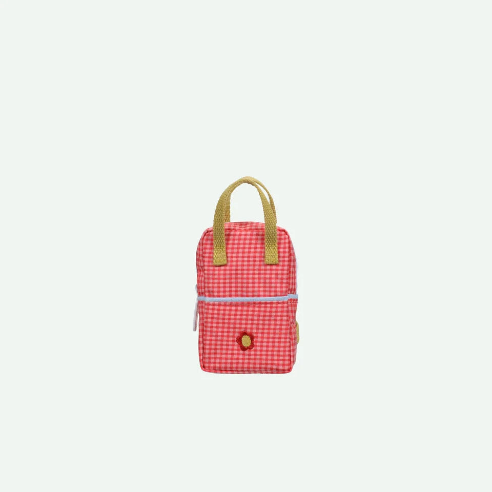 Small red checkered backpack with a mustard handle on a light gray background