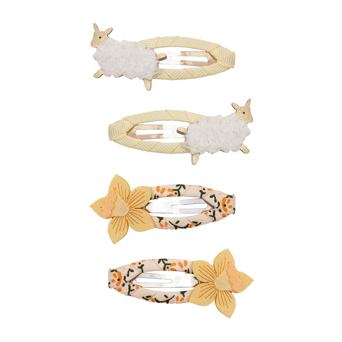 Set of four decorative hair clips with sheep and floral designs on a white background