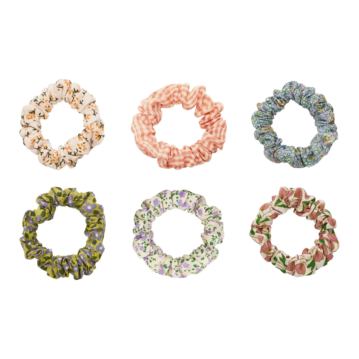 Set of six floral scrunchies on a white background