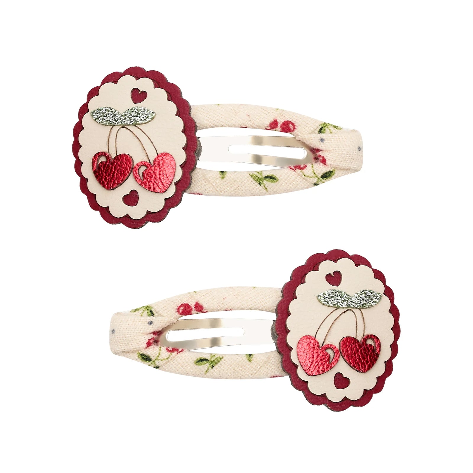 Pair of decorative hair clips with cherry design on a white background