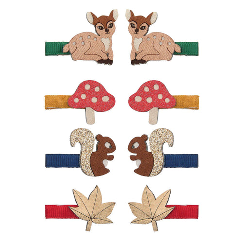 A set of six children's hair clips featuring woodland-themed designs including two deer clips, two red-and-white mushrooms, two squirrels, and two maple leaves, arranged on a plain white background.
