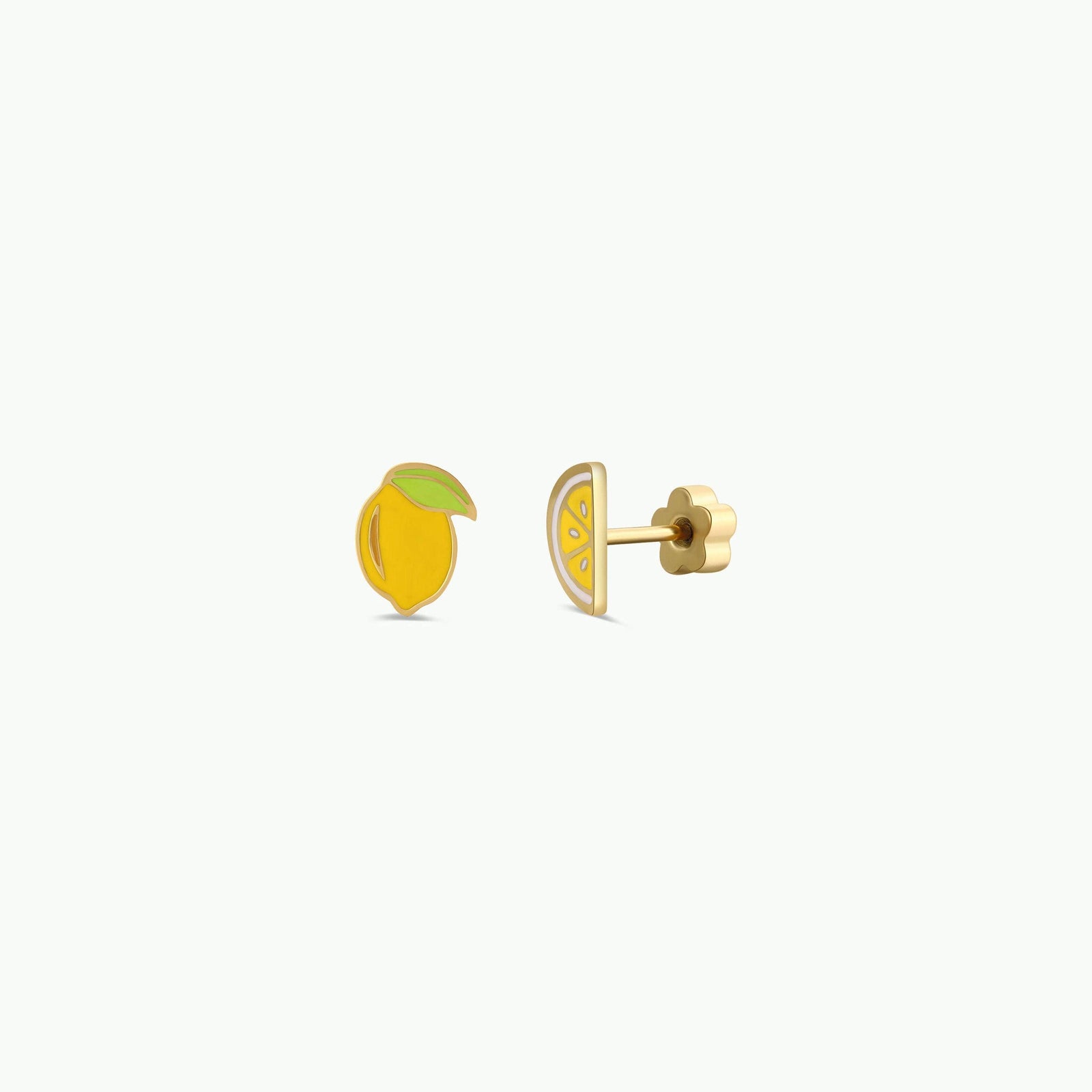 Gold lemon-shaped earrings on a white background