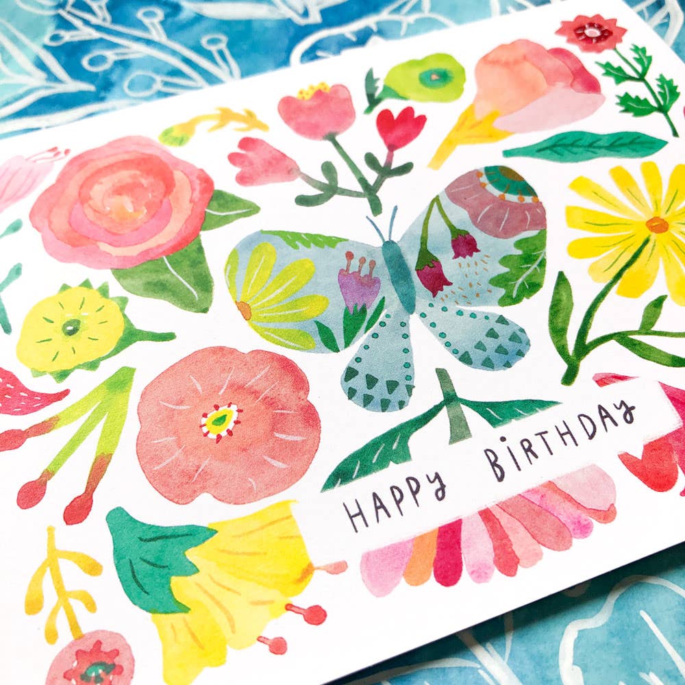 Colorful birthday card with flowers and a butterfly on a white background