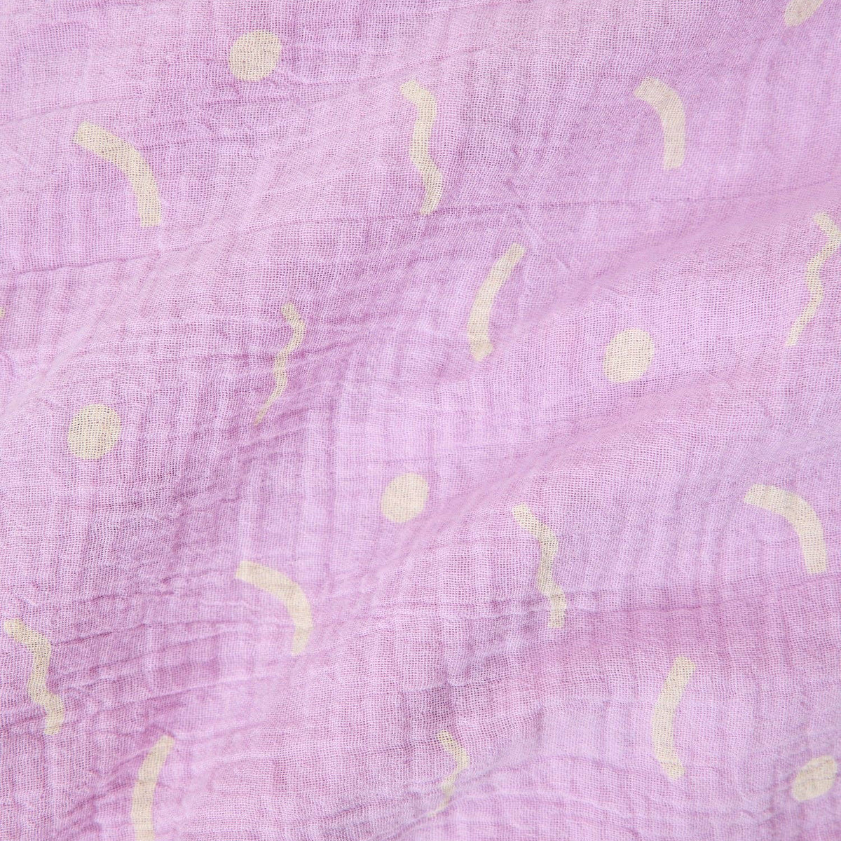 Purple fabric with light yellow abstract patterns
